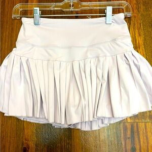 gold hinge look alike light pink athletic skirt size xs/s